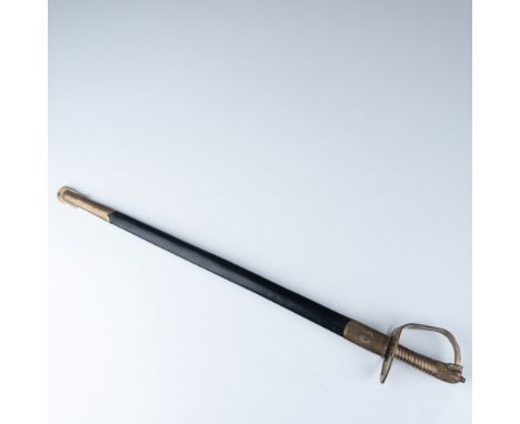 This antique sword features a polished steel blade, approximately 29" in length, with a brass hilt and guard. The blade is ma