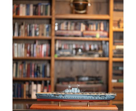 A meticulously detailed model of the USS Hornet (CV-8), commemorating its critical role in the historic Doolittle Raid of Apr