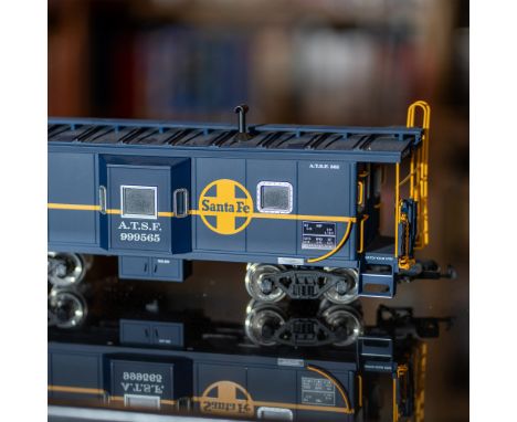 A highly detailed USA Trains R12051 Santa Fe Bay Window Caboose, marked with road number 999565, in G scale. This model repli