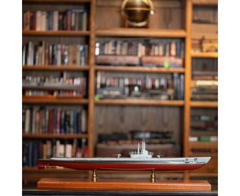 This expertly crafted scale model represents a U.S. Navy submarine, meticulously detailed and mounted on a polished wooden di