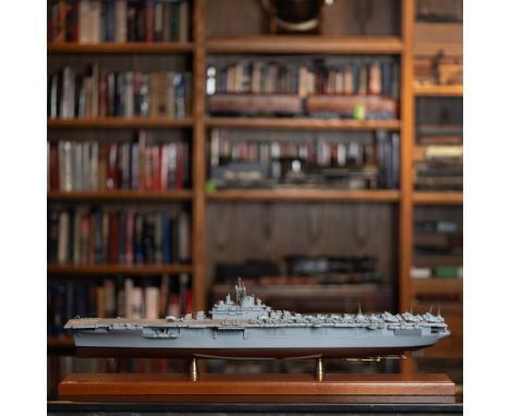 This finely crafted scale model represents the USS Enterprise, one of the most iconic aircraft carriers in naval history. The