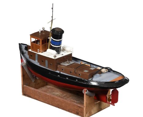 A large scale model of the steam tug boat 'Freddie', the model being scratch built from a copper boiler with wooden wheel-hou