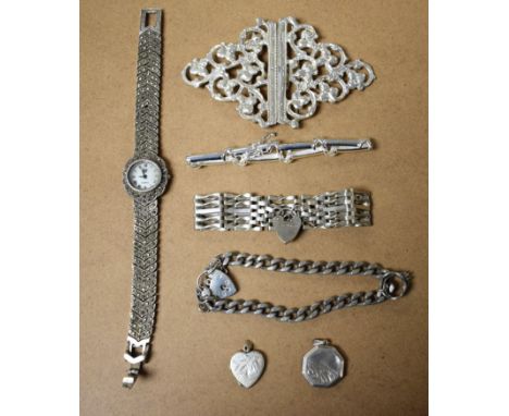 A silver gate bracelet, with heart shaped locket; a lady's marcasite watch, stamped 925; a white metal nurses buckle; etc.