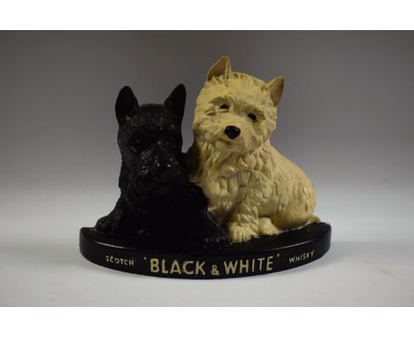 Advertising - a Black and White scotch whisky figural group