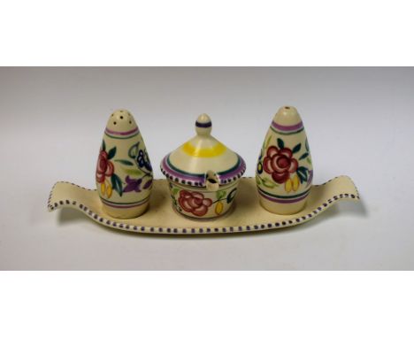 A Poole three piece condiment set, on tray, traditional colours