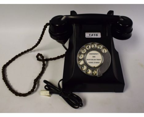 A vintage black cradle telephone