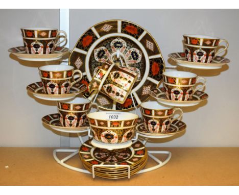 A Royal Crown Derby 1128 tea service for six, with cups, saucers, side plates, cake plate, milk and sugar