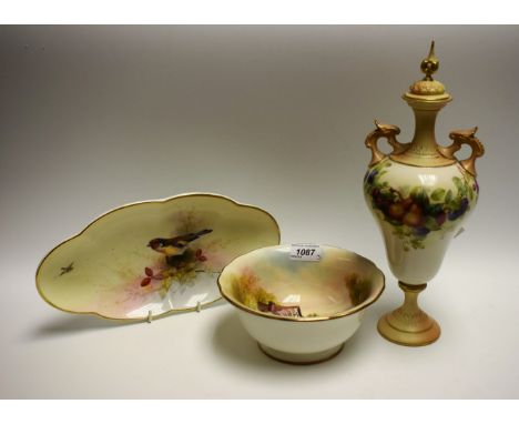 A Royal Worcester lobed oval dish, painted by E. Baker, signed, with goldfinch perched on rose hips, gilt line rim, 28cm wide