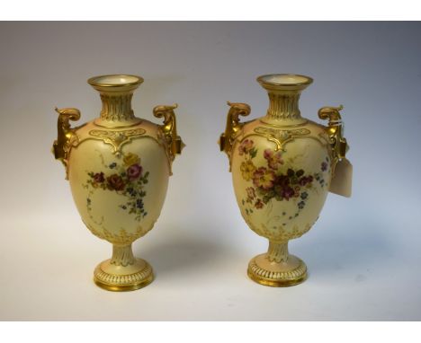 A pair of Royal Worcester two-handled pedestal ovoid vases, printed and painted with colourful summer flowers, on a blush ivo