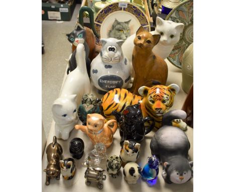 A late 20th century Staffordshire mantel cat, glazed in white; other models of domestic cats in wood, pottery, porcelain and 