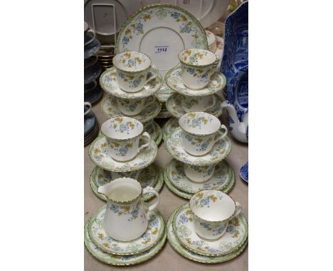 Ceramics - a Sutherland china tea service, twelve saucers, eleven cups, twelve side plates, two bread and butter plates, crea