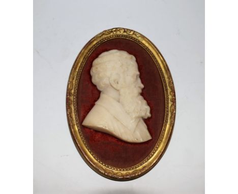 A 19th century Italian Grand Tour marble portrait profile, of Michelangelo, after Enea Vico, bust-length, red mount, oval gil