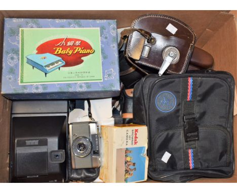 Cameras - Canon AT-1 SLR 35mm camera body; lenses; others, Bell and Howell cine camera; tripod; flash guns; etc