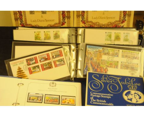 A collection of First Day Covers and stamps, including two Stanley Gibbons Charles &amp; Diana commonwealth mint stamp albums