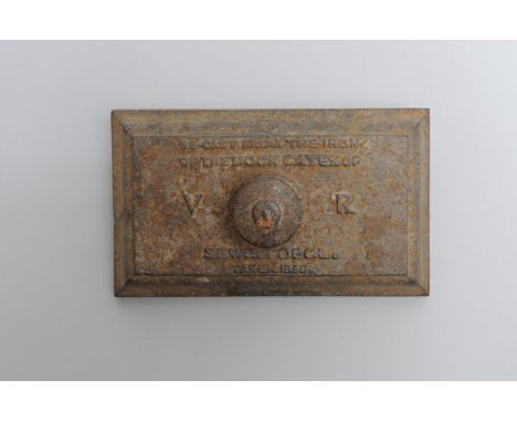 A mid-19th Century cast iron blotter or paperweight of Russian interest, lettered in relief 'Re-cast From The Iron Of The Doc