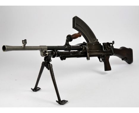 A British .303 Bren Light Machine Gun MkI, dated 1942, serial V8370, complete with five magazines, canvas cover dated 1945, c