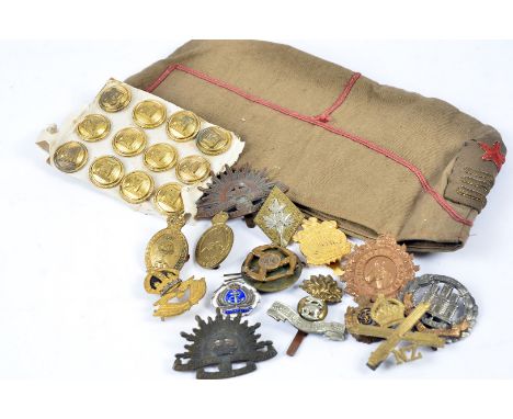 A collection of WWII and later badges, including a two piece Canadian Women's Army Corps, 4th Hussars of Canada, South Africa