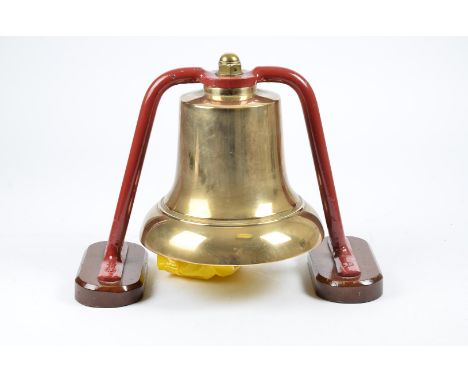 A 1920s Brass fire bell, from a Dennis Fire engine, complete with mount, on wooden bases 