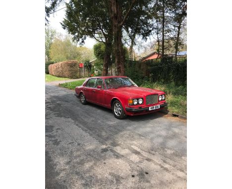 A Bentley Turbo R Saloon, first registered 1990, vermilion red with magnolia upholstery, sold as seen, 110,000 miles, appears