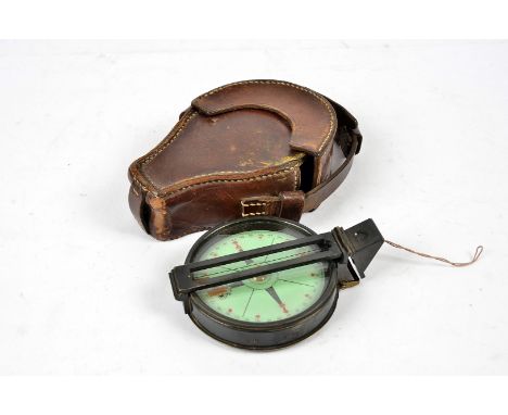 A WWII period pocket compass by J.H.Steward Ltd of Strand London, having green cardboard dial, with printed design, maker's n