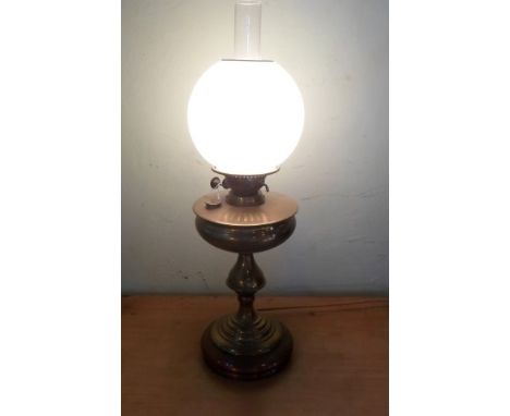 A Victorian brass oil lamp, later converted to electricity, 63cm.