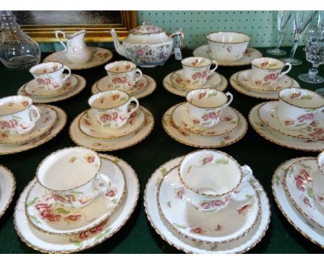 A late 19th/early 20th century Royal Albert Crown China tea service, a twelve place setting, comprising: trios, teapot, open 