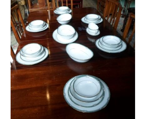 An extensive Noritake Glenabbey dinner service, a six place setting, comprising: dinner plates, bowls, trios, teapot, coffee 