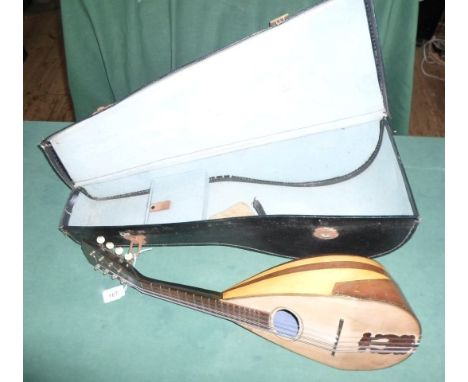 A 20th century lute, 8 strings, in fitted case, 56cm.