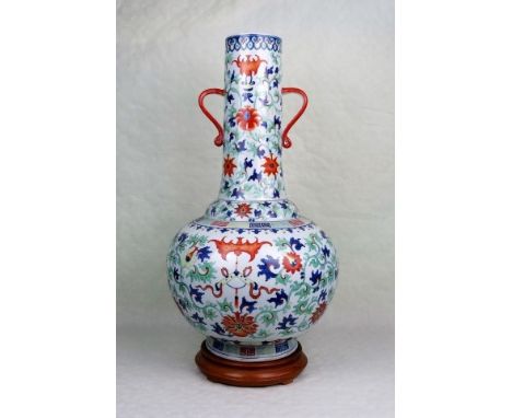 A Chinese twin handled vase of imposing proportions, having polychrome enamel foliate decoration on a white ground, blue six 