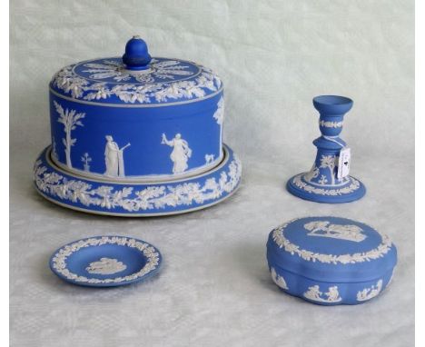 Three items of Wedgwood blue Jasperware, to include: candlestick, covered dish and a pin dish, together with a large blue and