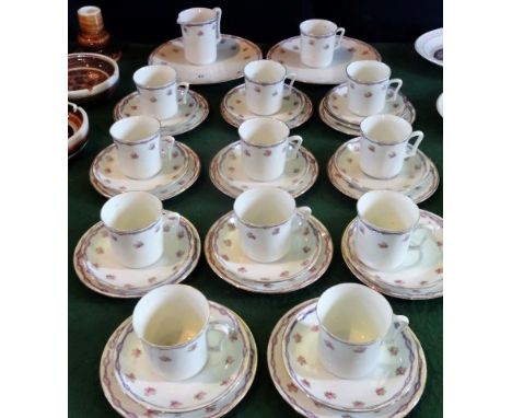 An early 20th century Sutherland part-tea service, comprising: eleven trios, two sandwich plates and a milk jug, having pink 