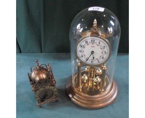 A contemporary brass torsion clock and dome, the circular enamel dial signed Kundo, 30cm, together with a brass lantern clock