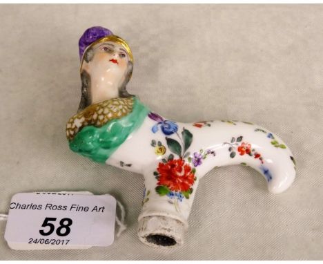 A 19th century Continental porcelain walking cane/parasol handle, possibly Meissen, formed as a head and shoulders bust of a 