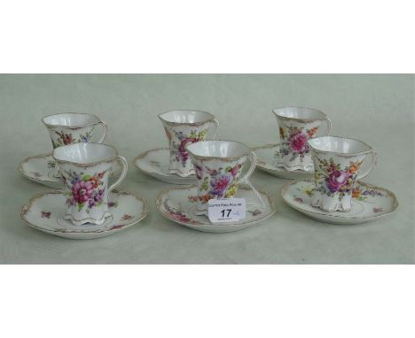 A set of six 19th century Rosenthal Dresden cabinet cups & saucers, having hand painted floral sprays on an ivory ground with