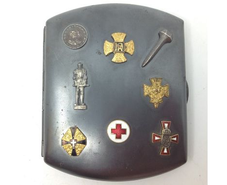 WW1 Austro - Hungarian blued steel cigarette case with eight applied enamel and gilt badges. Approx 90mm x 70mm.