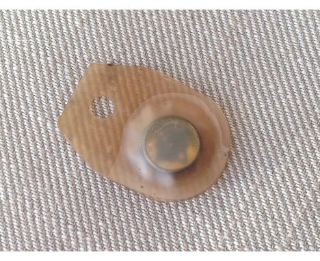 WW2 British RAF Escape Compass in rubber pouch. With hole for wear on a cord around the neck. Could be swallowed in the event