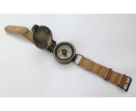 WW2 RAF Wrist Compass, complete with canvas strap. Marked on reverse No 11589/B.