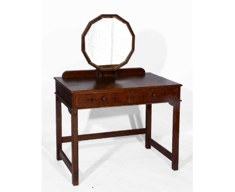 An early 20th Century Arts & Crafts oak dressing table in the manner of Heals, with twelve sided mirror on rectangular top, w