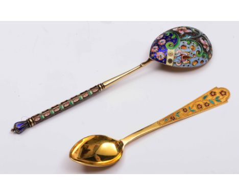 A Russian silver gilt and enamel spoon the back and handle decorated with panels of flowers and foliage, 17.5cm long and a 20