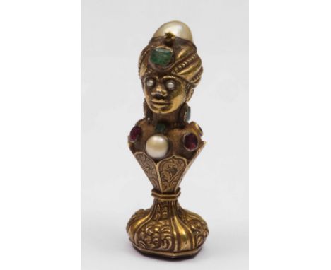 A continental mid 19th Century gilt metal and gem set seal in the form of a Moorish bust set throughout with coloured gem sto