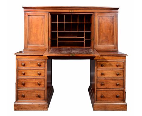 A Victorian mahogany architect's desk of two tier form, the top with fall front and fitted interior, monogrammed CL and dated