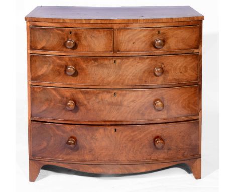 A 19th Century mahogany bow front chest of two short and three long drawers with crossbanded top and turned handles, 103cm