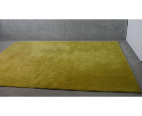 A contemporary John Lewis pure wool Wellington carpet, hand made in India, citrine hue, with labels to the reverse. 200 x 300