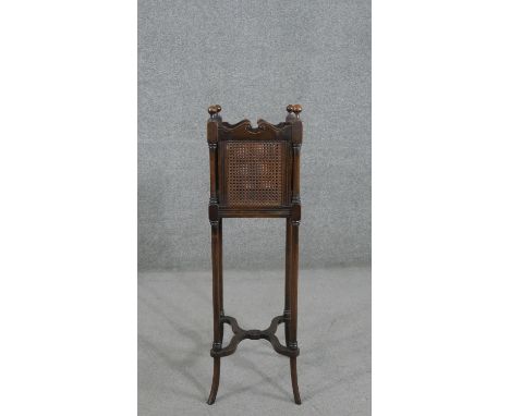 A French walnut planter, the square top with knob finials and caned sides, on cylindrical splayed legs with X stretchers. H.8