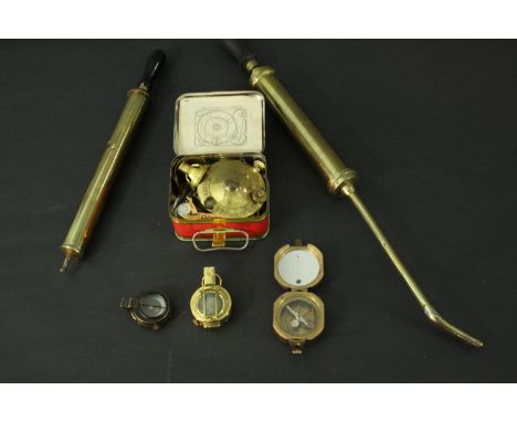 A collection of brass instruments. Including a Stanley London brass nautical compass with Natural Sine table to outer casing,