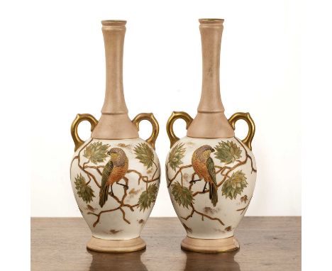 Pair of Zsolnay pecs vasesHungarian, each with twin handles and decorated with birds, flowers and butterflies, 27cm high   Ch