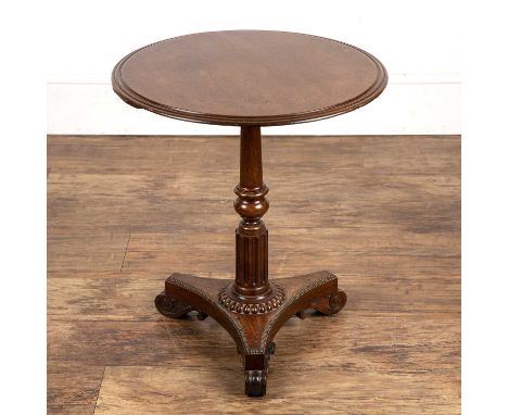 Mahogany lamp tableearly 19th Century, with a turned and fluted column and triform base, 48cm diameter x 55cm highWith some l