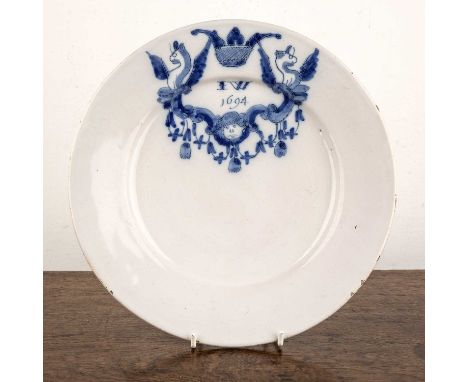 Delftware blue and white tin-glazed plate 17th/18th Century, painted with cartouche, griffins to each side of the cartouche, 