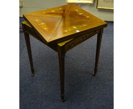 An Edwardian rosewood envelope card table, the swivel top enclosing green felt lined interior, above single drawer, decorated