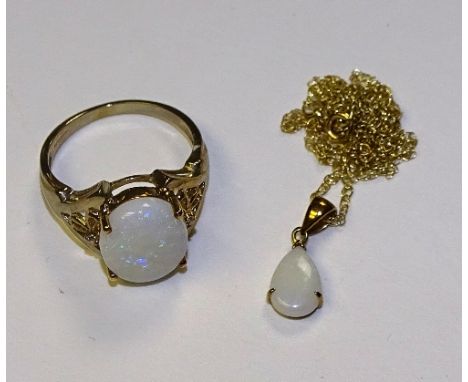 A 9ct gold Andamooka opal ring, stamped 375 to underside, ring size N, 3.6g, together with a near matching 9ct gold opal pend